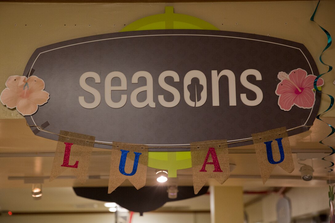 U.S. Marines stationed at Marine Corps Air Station (MCAS) Yuma are served a Traditional Pig Roast at the mess hall on MCAS Yuma Ariz., June 19, 2019. The roasted pig is part of MCAS Yuma’s annual Hawaiian Luau Meal, which is intended to raise the spirits and fill the bellies of the Marines and Sailors stationed at MCAS Yuma. (U.S. Marine Corps photo by Cpl. Joel Soriano)