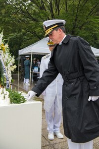 BUSAN, Republic of Korea (June 26, 2019) Rear Adm. Michael "Buzz" Donnelly, commander, U.S. Naval Forces Korea, places a flower at Gungang Park during a ceremony commemorating the 69th anniversary of the Battle of Daehan Strait. The Battle of Daehan Strait marked the start of the Korean war, when a North Korean troop transport carrying hundreds of troops attempted to land near Busan, but was sunk by a South Korean patrol ship.