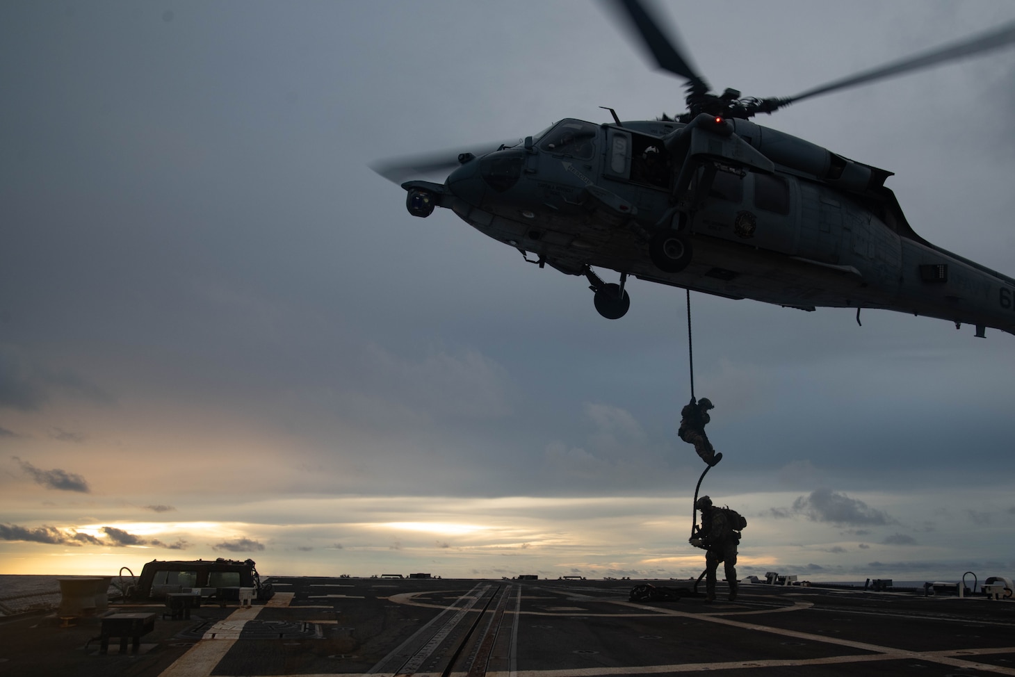 190625-N-RF825-1397 SOUTH CHINA SEA — Sailors from Explosive Ordnance Disposal Mobile Unit 5 attached to Commander Task Force (CTF) 70 conduct Helicopter Vertical Board Search and Seizure (HVBSS) training operations aboard USS McCampbell (DDG 85). CTF 70 is forward-deployed to the U.S. Seventh Fleet area of operations in support of security and stability in the Indo-Pacific Region.