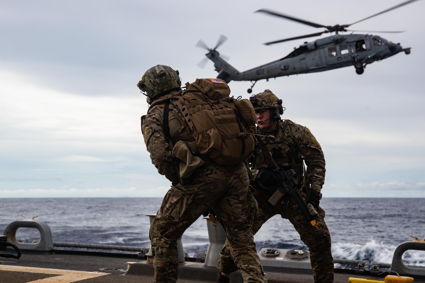 190625-N-RF825-1085 SOUTH CHINA SEA — Sailors from Explosive Ordnance Disposal Mobile Unit 5 attached to Commander Task Force (CTF) 70 conduct Helicopter Vertical Board Search and Seizure (HVBSS) training operations aboard USS McCampbell (DDG 85). CTF 70 is forward-deployed to the U.S. Seventh Fleet area of operations in support of security and stability in the Indo-Pacific Region.
