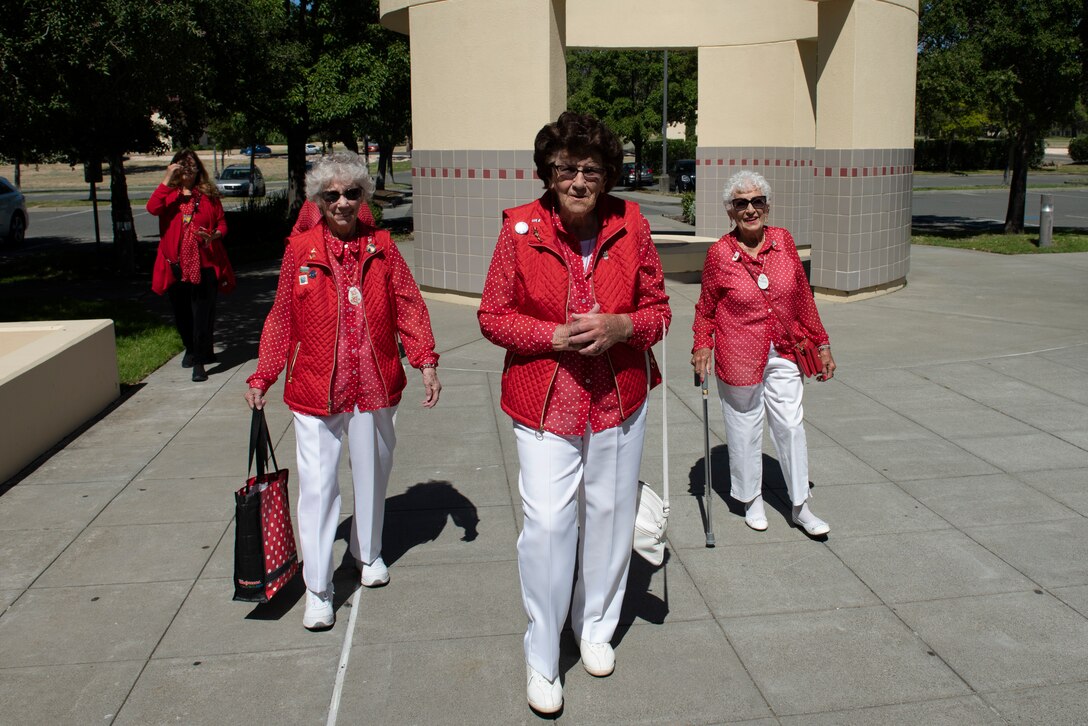 Marian Sousa, left, Marian Wynn, center, and Kay Morrison, right, walk toward the Monarch Dining Facility June 25, 2019, at Travis Air Force Base, California. The women all worked in the Richmond, California, Kaiser Shipyard during World War II. They were at Travis to meet with 60th Air Mobility Wing leadership, have lunch with Airmen and share their experiences. (U.S. Air Force photo by Tech. Sgt. James Hodgman)