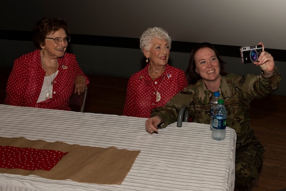 A U.S. Air Force Airman takes a selfie with Agnes Moore, left, and Kay Morrison, center, after a ‘Rosie the Riveter’ presentation June 25, 2019, at Travis Air Force Base, California. Moore and Morrison are two of the many women known as “Rosie” as they worked as welders in the Richmond, California, Kaiser Shipyard during World War II. During a visit to Travis AFB, the duo joined two other Rosies and met with 60th Air Mobility Wing leadership, had lunch with Airmen and shared their experiences. (U.S. Air Force photo by Tech. Sgt. James Hodgman)