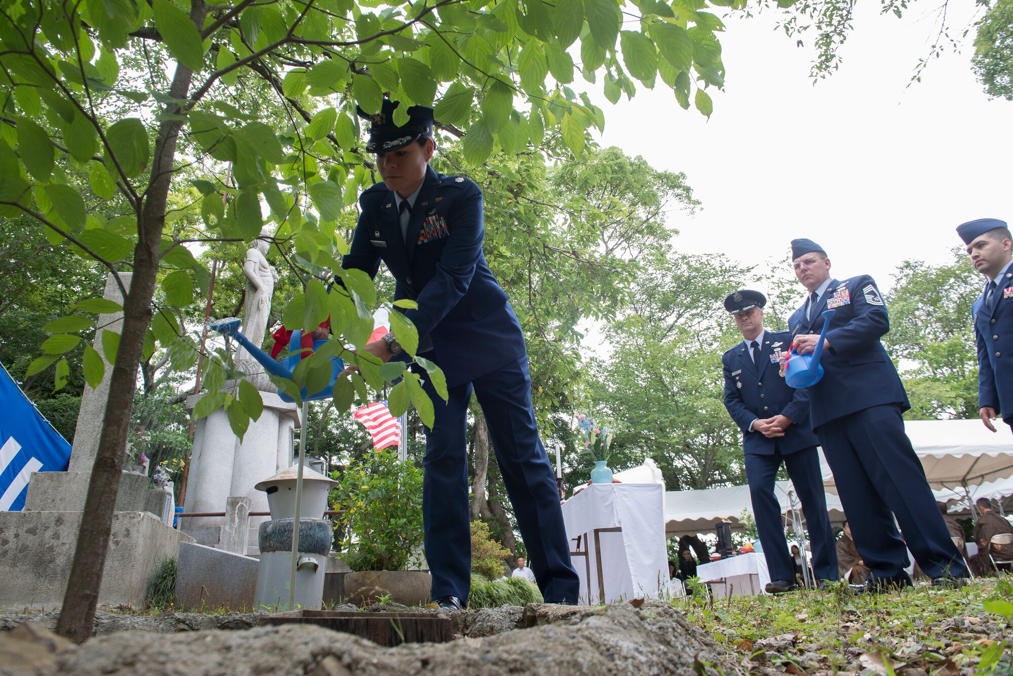 Lt. Col. Cataleya Carlson, 36th Airlift Squadron commander, waters a dogwood tree during the 47th annual B-29 Memorial Ceremony, at Sengen Shrine in Shizuoka City, Japan, June 22, 2019.