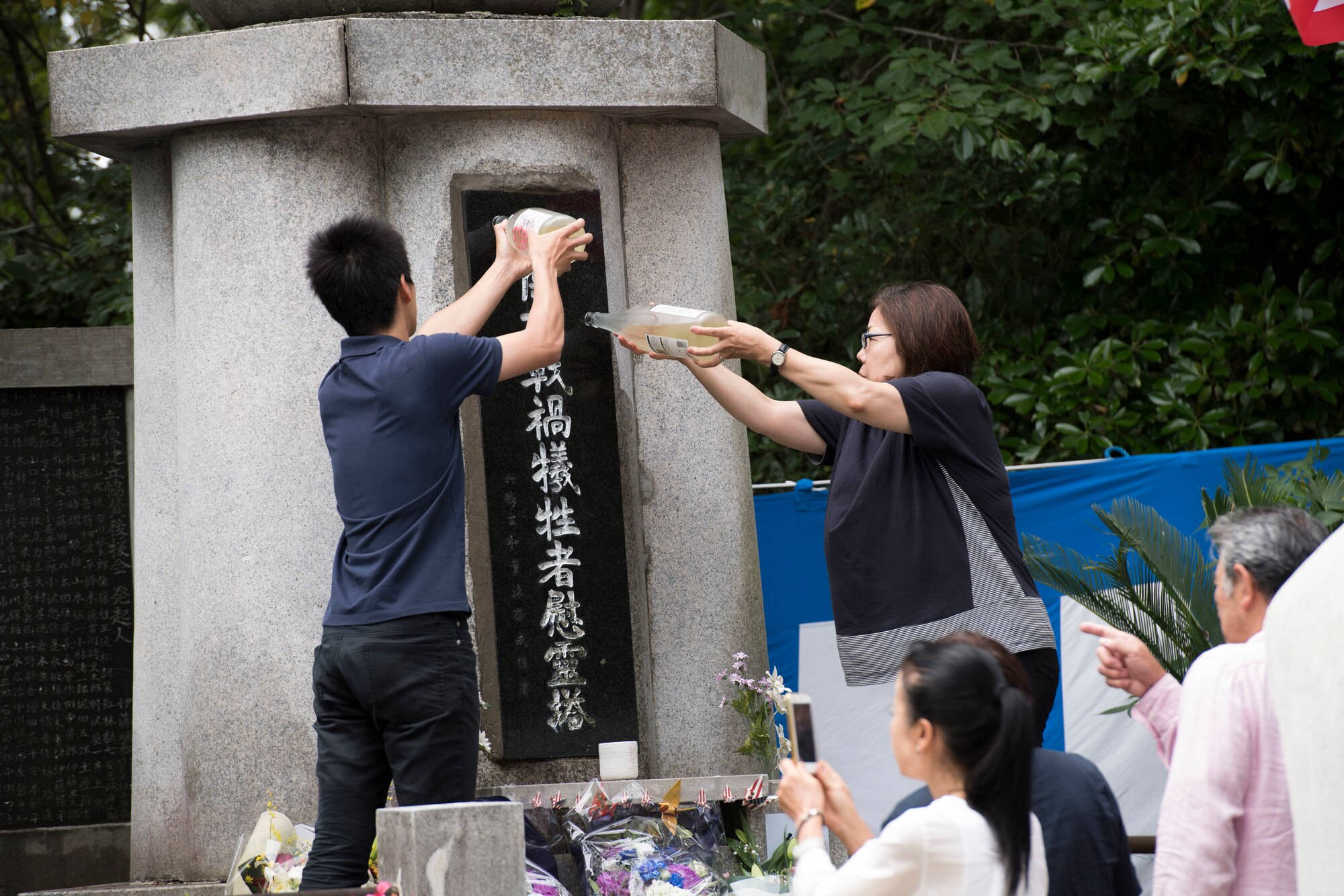 Japanese locals pour sake on the Japanese B-29 memorial monument during the 47th annual B-29 Memorial Ceremony at Sengen Shrine in Shizuoka City, Japan, June 22, 2019.