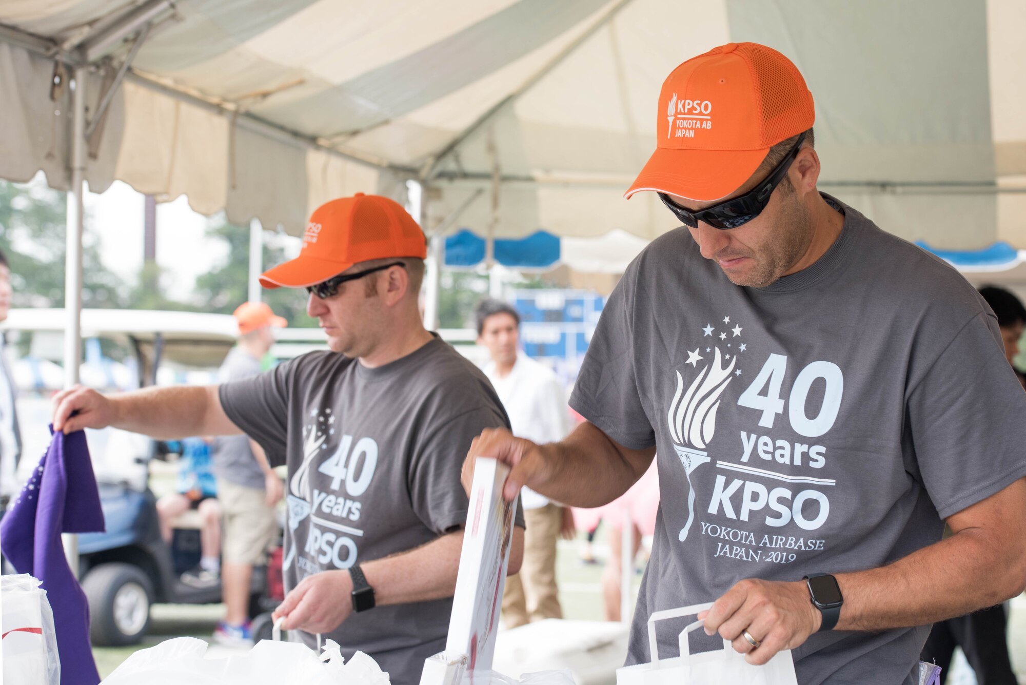 (Left to right) Senior Master Sgt. Joseph Stratton, president of the Kanto Plains Special Olympics committee and Master Sgt. Richard Craft, treasurer of the KPSO committee, prepare for opening ceremony on the day of event at Yokota Air Base, Japan, June 1, 2019.