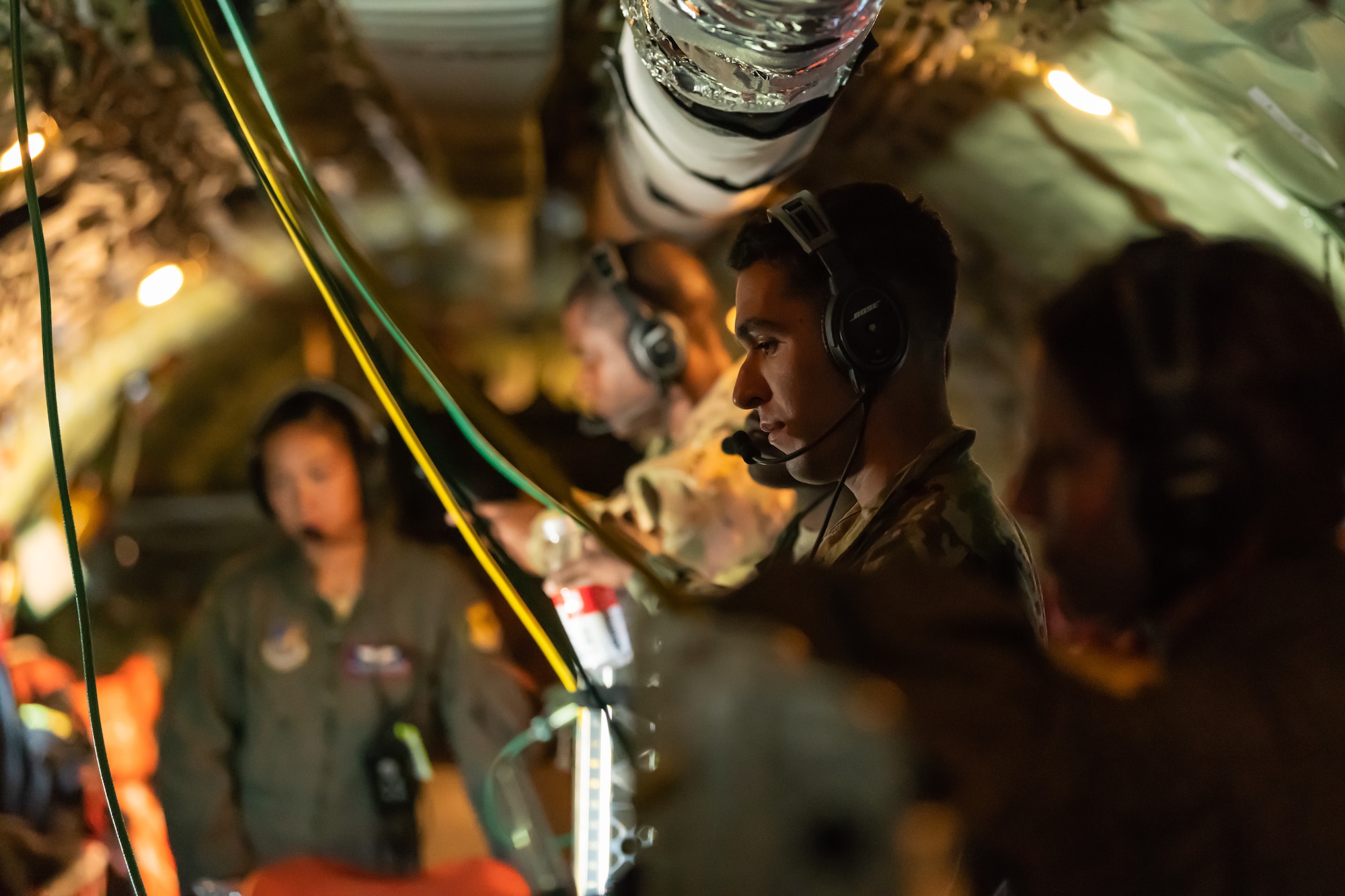 Airmen from the 18th Aeromedical Evacuation Squadron go over their electronic flight books onboard a KC-135 Stratotanker during an exercise May 8th, 2019, out of Kadena Air Base, Japan. The 18th AES maintains a forward operating presence and supports medical contingencies in a free-and-open Indo-Pacific. (U.S. Air Force photo by Airman 1st Class Matthew Seefeldt)