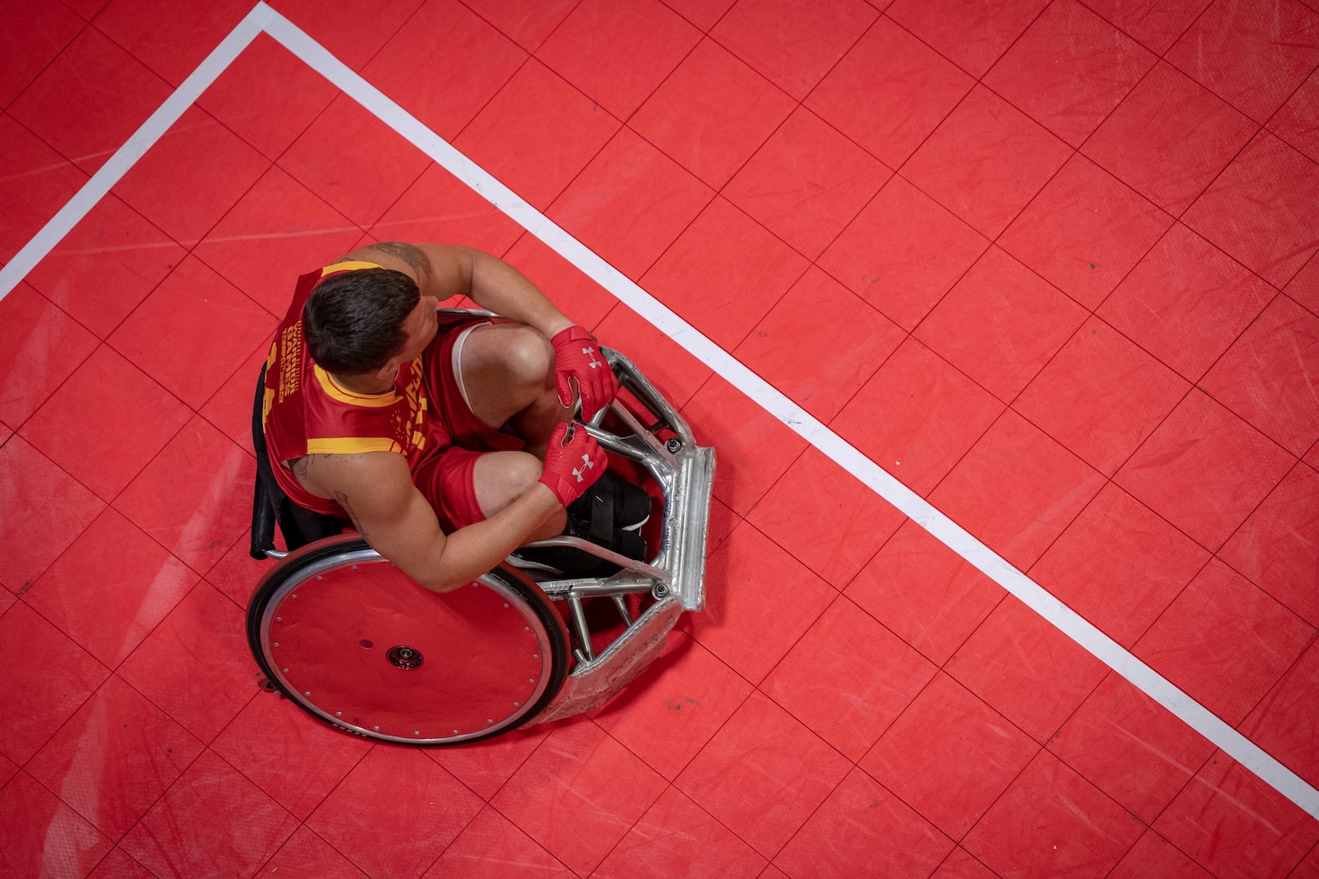 Overhead photo of a Wounded Warrior prepares for a wheelchair rugby match during the 2019 DoD Warrior Games in Tampa, Florida.
