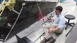 Solomon Duning, Research Engineer from The University of Dayton Research Institute, uses laser scanning technology to inspect an F-16 vertical tail on a depot fixture. (Courtesy photo)
