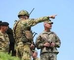 U.S. Army Lt. General Christopher Cavoli, commander, U.S. Army Europe, receives a briefing from Hungarian Defense Forces Col. Vokla Janos (left), commander, Bakony Combat Training Centre while observing a live-fire exercise as part of Breakthrough 2019, Koroshegy Hill, Hungary, June 12, 2019.