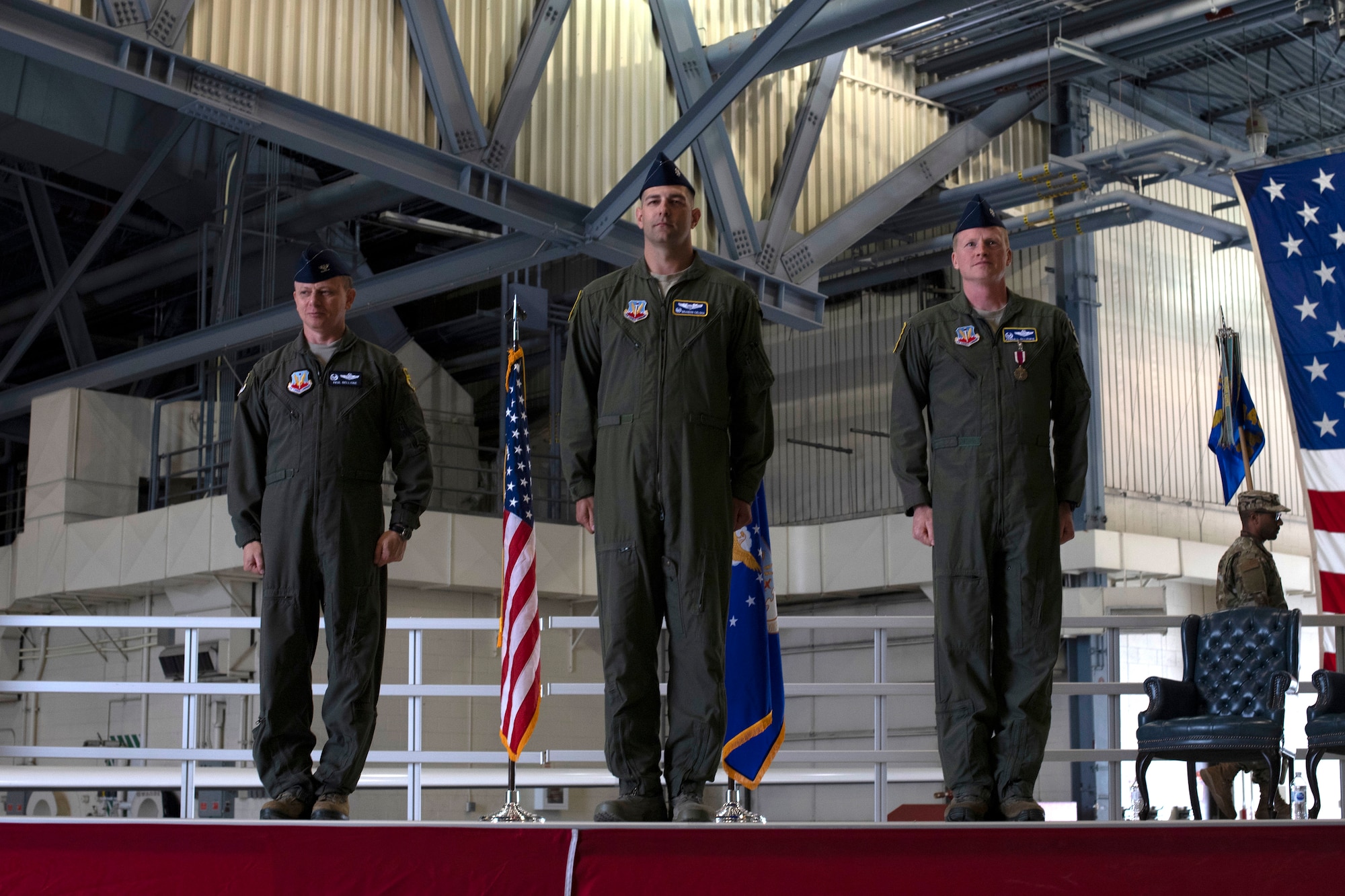 Lt. Col. Brandon Cieloha, 348th Reconnaissance Squadron commander, center, stands at attention between Col. Anthony Bellione, 69th Reconnaissance Group commander, left, and Lt. Col. Kendal Gillespie, 348 RS outgoing commander, following a change of command ceremony June 20, 2019, on Grand Forks Air Force Base, North Dakota. Prior to becoming 348 RS commander, Cieloha was the 319th Air Base Wing chief of safety and director of staff. (U.S. Air Force photo by Senior Airman Elora J. Martinez)