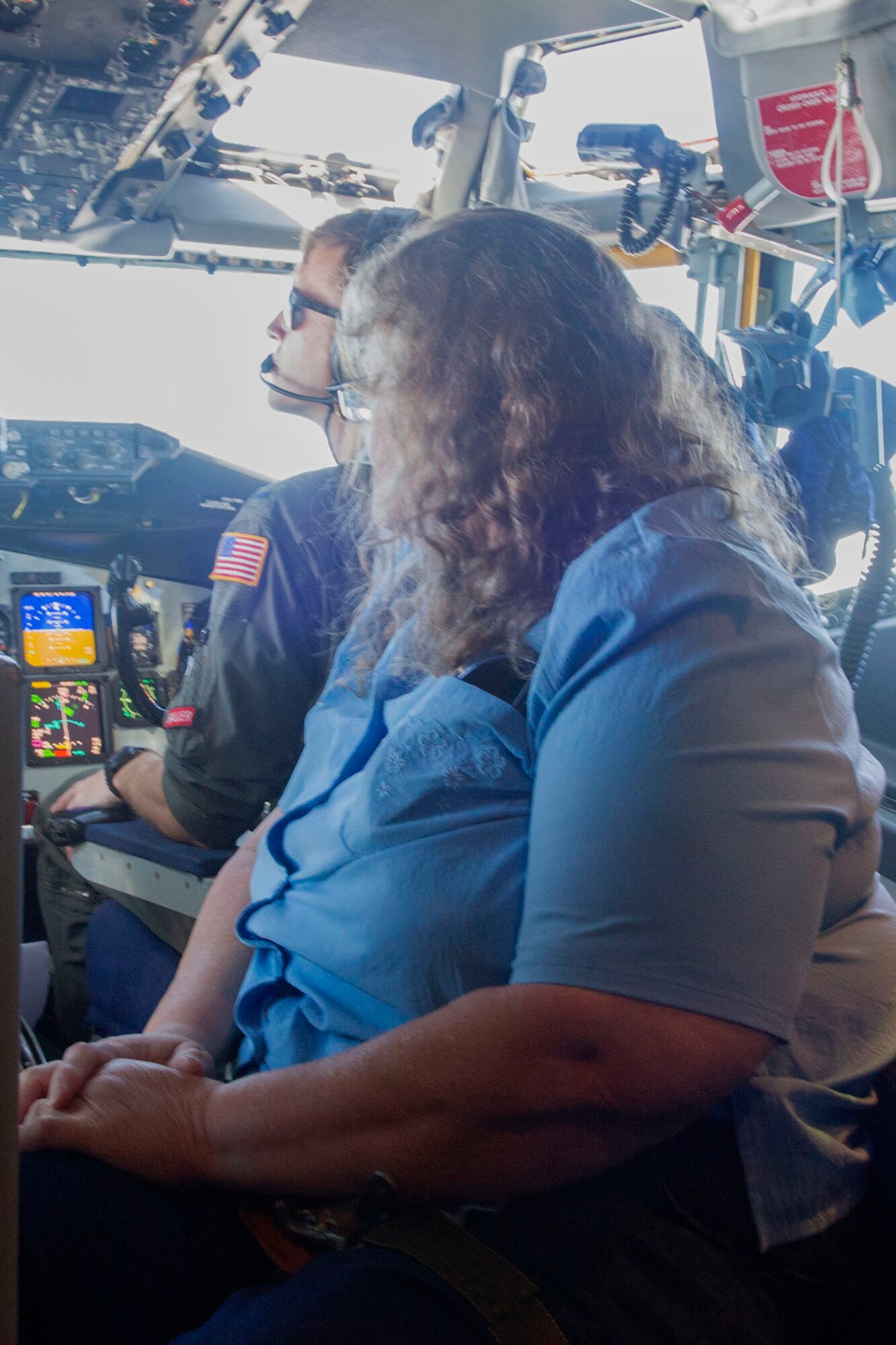 A team member with the dining facility at Grissom Air Reserve Base observes pilots in the flight deck during a refueling in one of Grissom’s KC-135R Stratotankers, June 25, 2019. Services support staff from throughout the base got a firsthand look at the mission they help support at Grissom during an employee incentive flight.