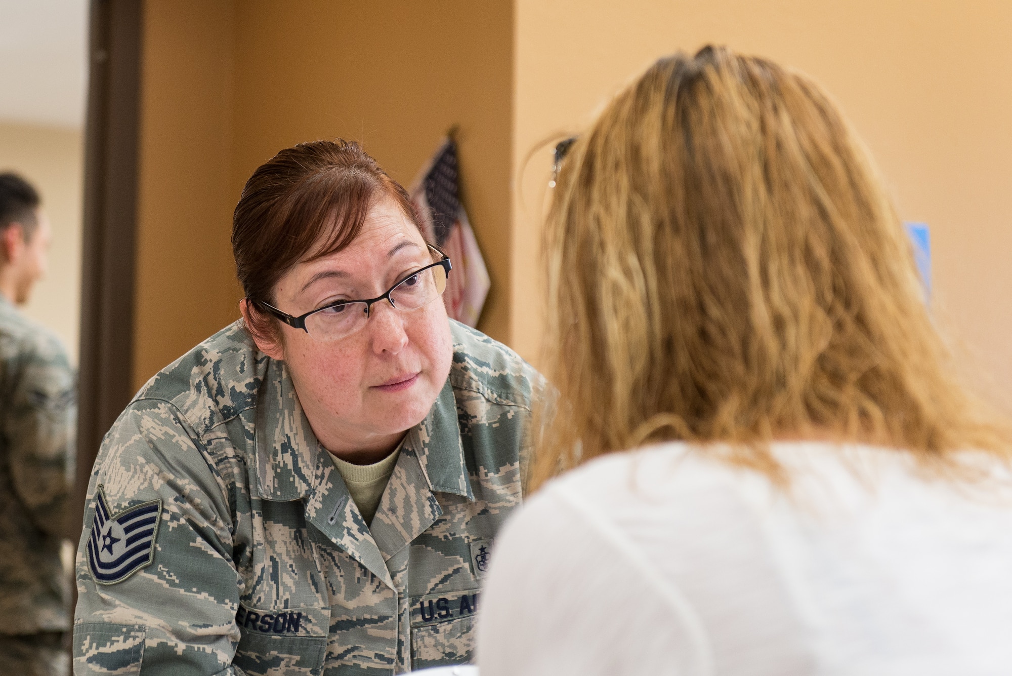 U.S. Air Force Tech. Sgt. Susan Jefferson, an aerospace medical technician assigned to the 175th Wing, Maryland Air National Guard, speaks to a patient at a temporary medical clinic in Sikeston, Mo., June 21, 2019.