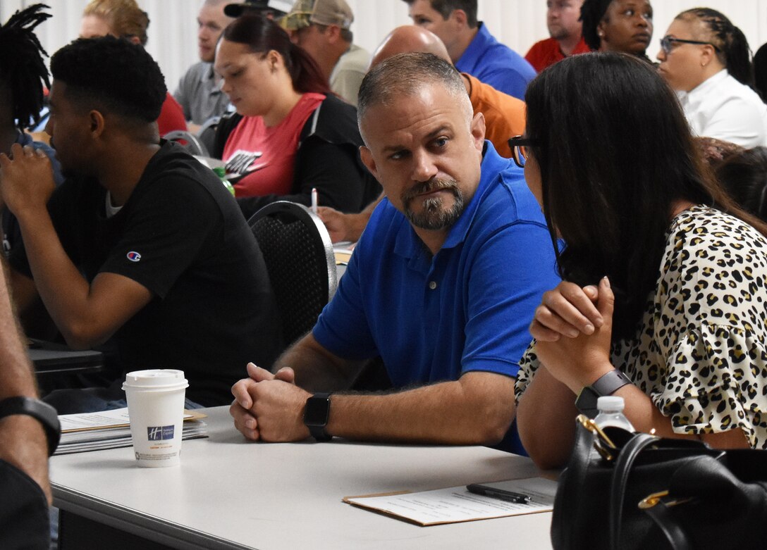 Andrea Tosolini, the Warner Robins Air Logistics Complex's 1,200th hire of its '1200 in 12' hiring initiative was sworn in June 24, 2019. The Florida native and 21-year Air Force veteran said getting the job was like winning the lottery. The Warner Robins Air Logistics Complex announced its initiative during a press conference Aug. 15, 2018. The task at hand was to hire 1,200 new workers within 12 months, or by the end of fiscal 2019. At the time 7,200 personnel worked for the complex, providing maintenance and repair for several aircraft and components, as well as F-15 engineering. (U.S. Air Force photo by Ed Aspera)