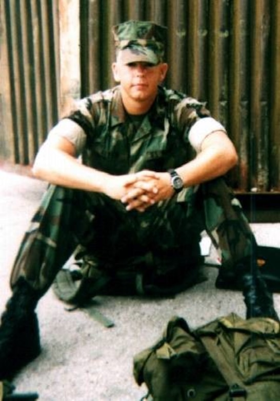 Lance Cpl. Ryan Allen, Motor Transport Operator, sits on the ground in 2001, at Ft. Leornardwood, Mo.