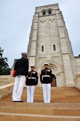 Staff Sgt. Ryan Allen, (middle), stands at attention during his reenlistment ceremony in 2011, at the Belleau Wood Memorial, France.