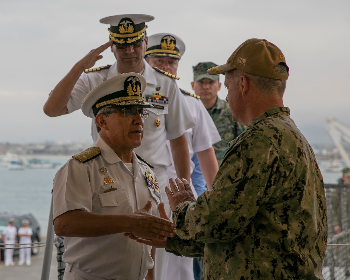 Ecuadorian Navy Rear Admiral Amilcar Villavicencio, commander of naval operations (left) is greeted by Capt. Kevin Buckley.