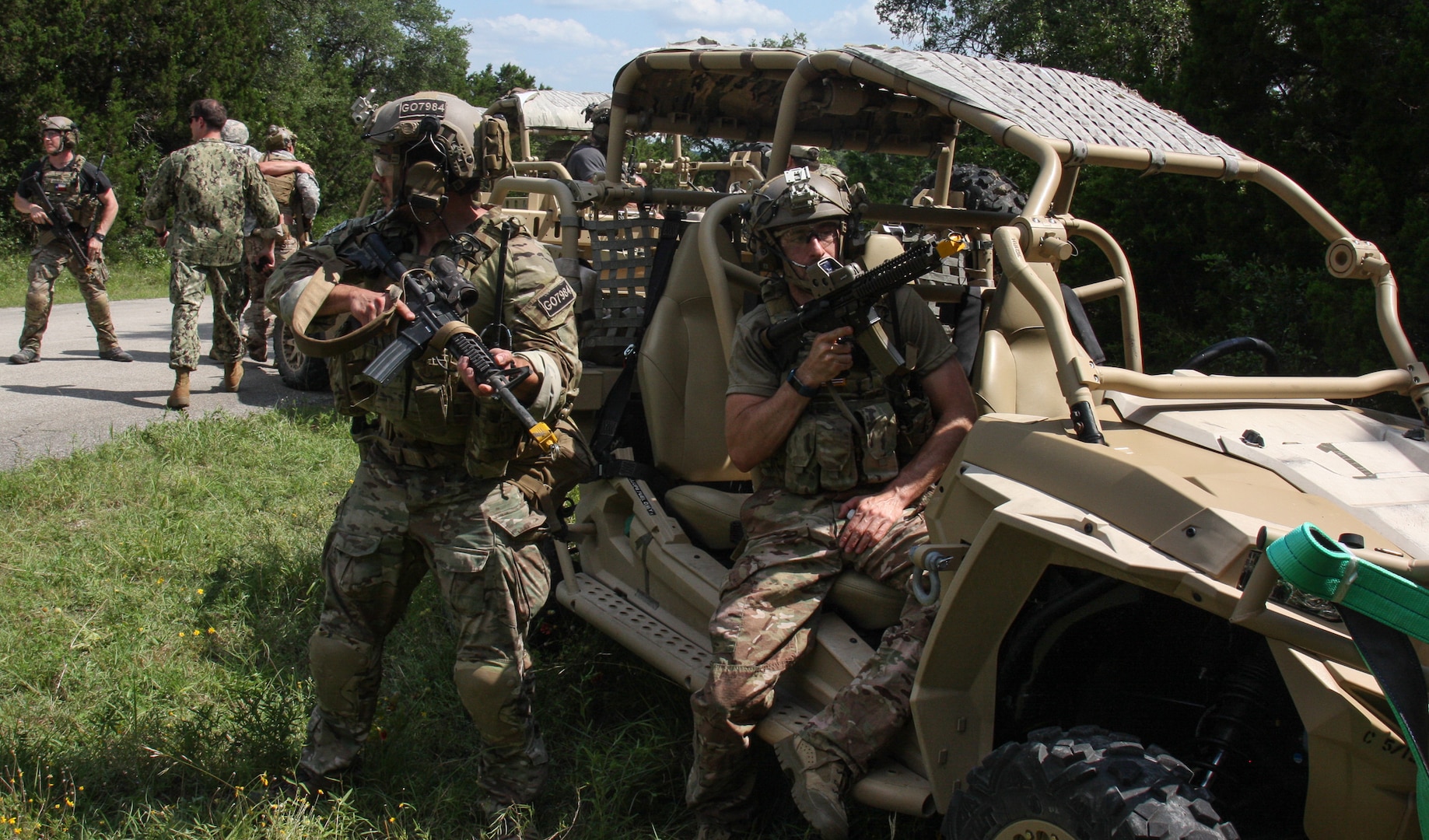 Special Forces Soldiers participating in the 2019 Joint Emergency Medicine Exercise June 15 offer cover during casualty removal during a simulated ambush at Joint Base San Antonio-Camp Bullis.