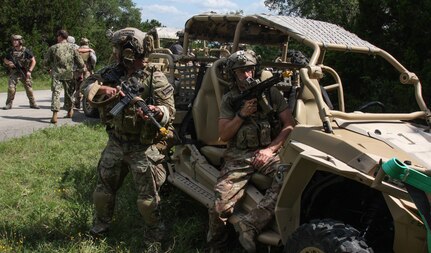 Special Forces Soldiers participating in the 2019 Joint Emergency Medicine Exercise June 15 offer cover during casualty removal during a simulated ambush at Joint Base San Antonio-Camp Bullis.