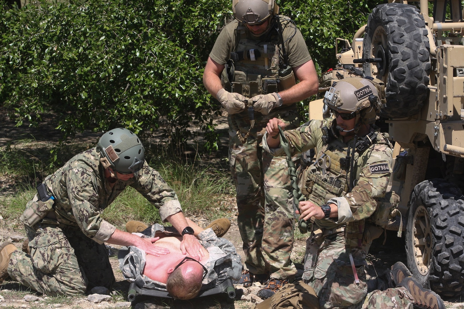 Emergency Medicine physicians observe Special Forces responding to casualties during a simulated ambush June 14 at Joint Base San Antonio-Camp Bullis during the 2019 Joint Emergency Medicine Exercise.