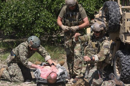 Emergency Medicine physicians observe Special Forces responding to casualties during a simulated ambush June 14 at Joint Base San Antonio-Camp Bullis during the 2019 Joint Emergency Medicine Exercise.