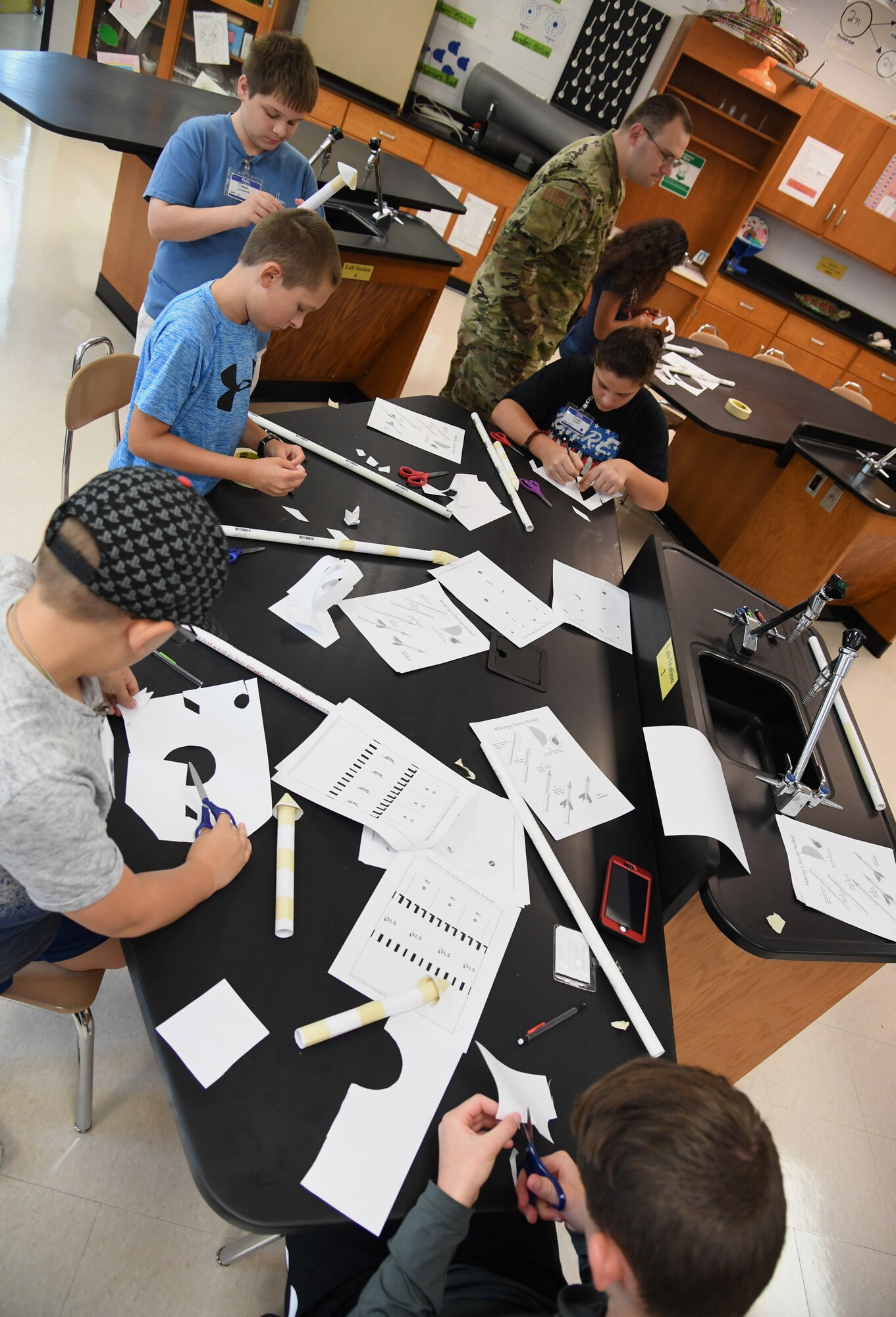 Sixth-grade students assemble jet propulsion laboratory stomp rockets during the Biloxi Public Schools Science, Technology, Engineering and Mathematics Summer Camp program at Biloxi High School in Biloxi, Mississippi, June 25, 2019. The four-day STEM summer program teaches first through seventh grade students skills for future careers and fosters valuable life skills like problem solving, creativity and collaboration. Keesler personnel volunteered their time to lead instructions on various projects. (U.S. Air Force photo by Kemberly Groue)