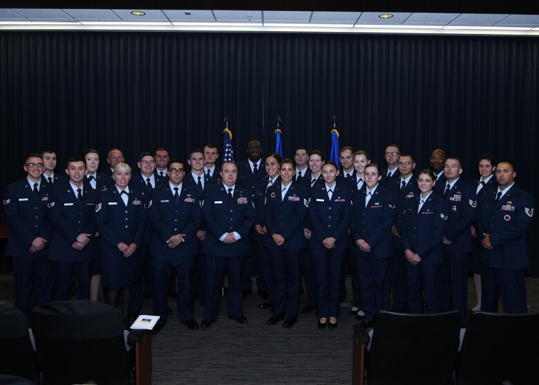PETERSON AIR FORCE BASE, Colo.—Twenty-eight Airmen from the Front Range graduate from the Community College of the Air Force June 19, 2019 at the Summit Center on Peterson Air Force Base, Colorado. The college annually awards over 22,000 associate degrees in applied science, seeking to aid the Air Force enlisted corps in personal and professional growth. (U.S. Air Force photo by Airman 1st Class Andrew J. Bertain)