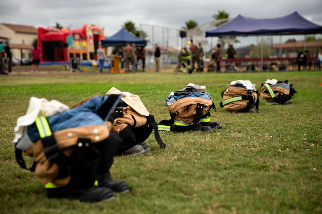 Aircraft Rescue and Firefighting (ARFF) Marines station their equipment to race to see who gets their gear on first on Marine Corps Air Station Miramar, Calif., June 22. The ARFF rodeo is an annual event held by H&HS to build unit cohesion and boost morale through various competitions between different ARFF units. (U.S. Marine Corps photo by Lance Cpl. Cheng Chang)