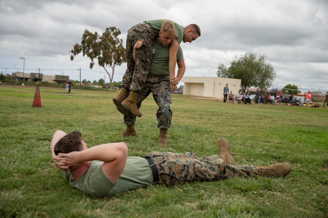 Marines competing in the Aircraft Rescue and Firefighting (ARFF) rodeo conduct fireman carry drills for the competition at Marine Corps Air Station Miramar, Calif., June 22. The ARFF rodeo is an annual event held by H&HS to build unit cohesion and boost morale through various competitions between different ARFF units. (U.S. Marine Corps photo by Lance Cpl. Cheng Chang)