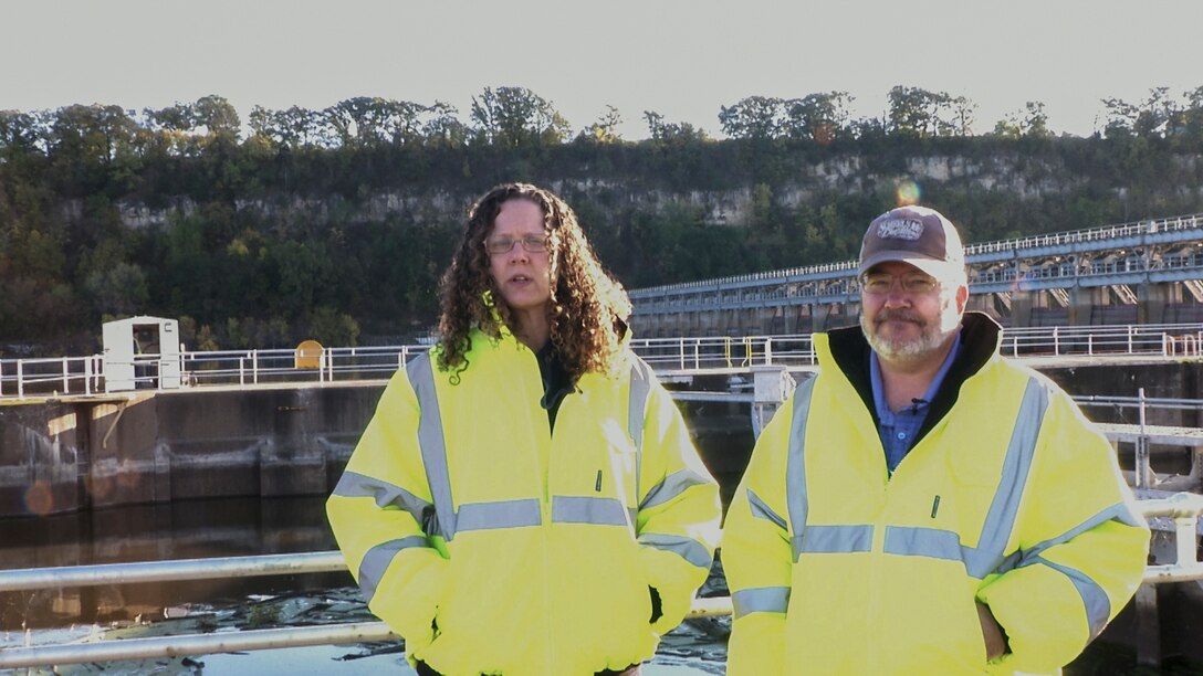 safety officers pose at lock and dam