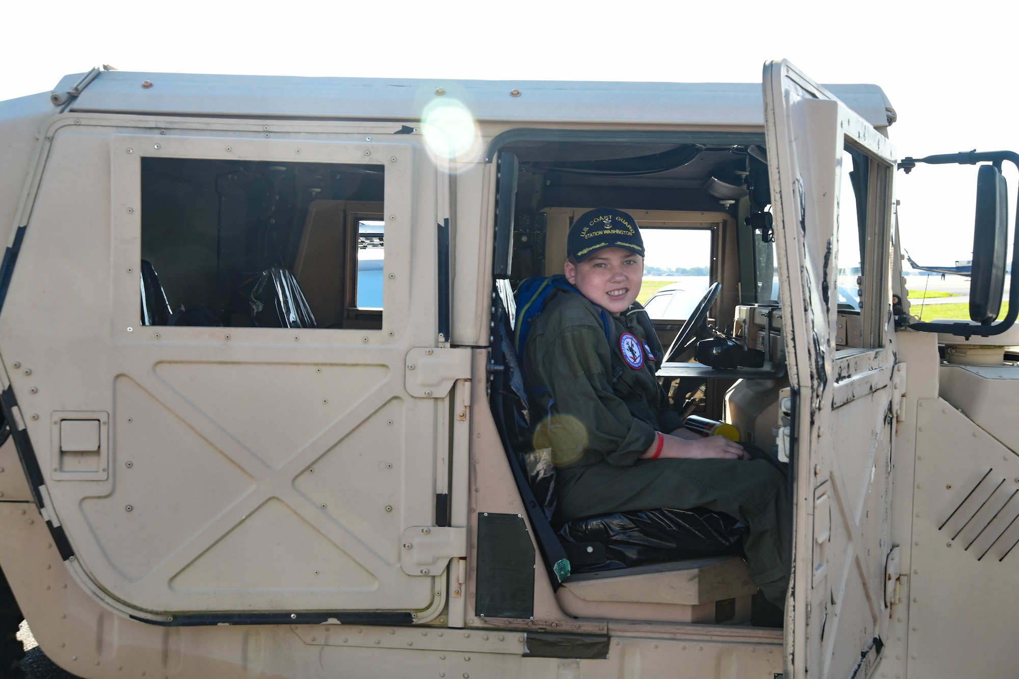 O’Rian Jolley, The Check-6 Foundation pilot for a day, sits in a Humvee on Joint Base Andrews, June 26, 2019. Diagnosed with hydrocephalus, severe gastro-esophageal reflux and most recently an extremely rare primary carnitine deficiency and mitochondrial diseases of the brain, O’Rian was selected to be an honorary pilot to experience a day at JBA and the National Harbor. O’Rian wants to someday serve his country as an Aviation Survival Technician in the US Coast Guard. (U.S. Air National Guard photo by Erica Flores)