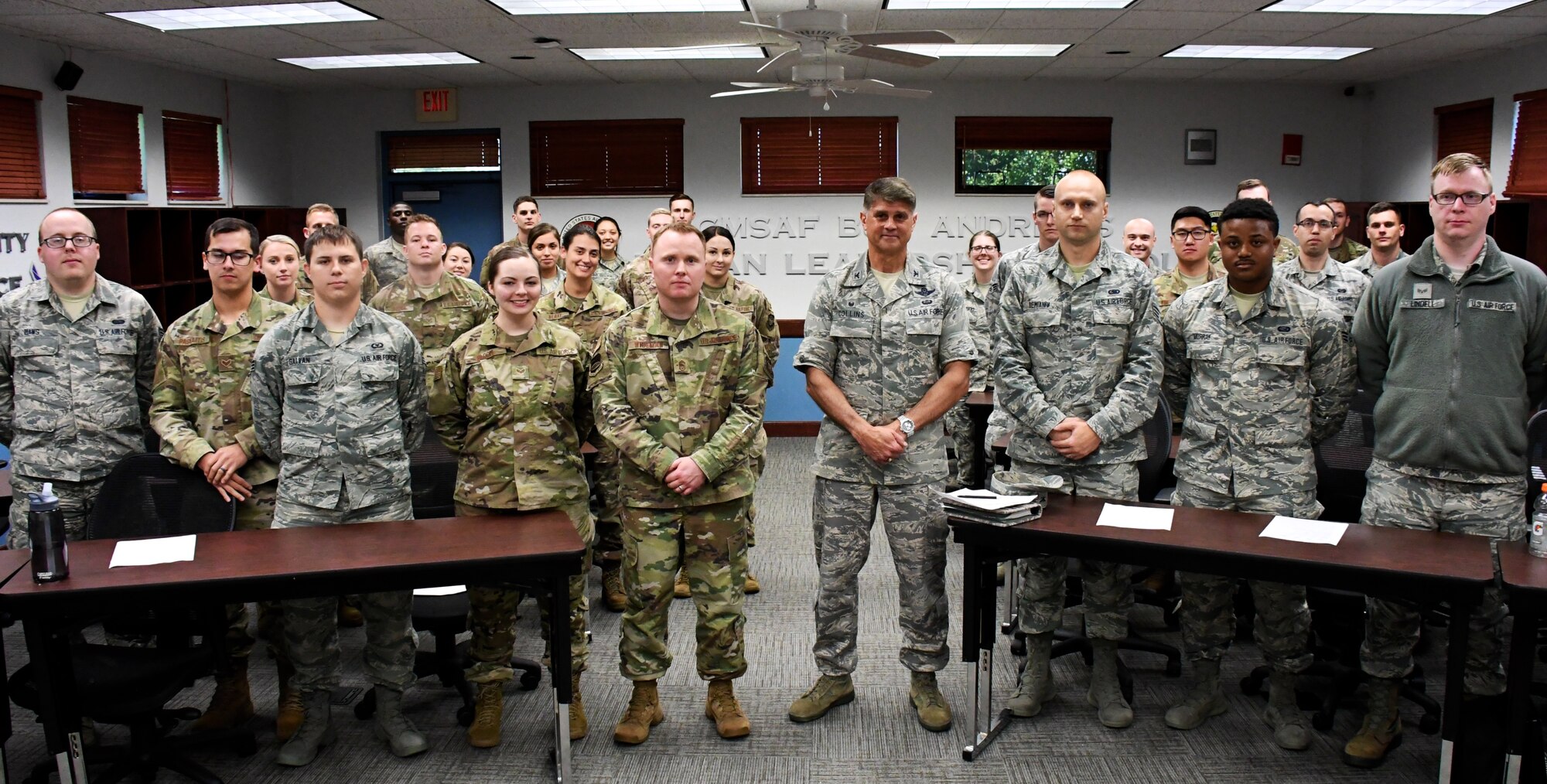 Commander of the 932nd Airlift Wing, Col. Glenn Collins, fourth from right, made a visit to the Airman Leadership School on June 11, 2019, at Scott Air Force Base, Ill.  He and Chief Master Sgt. Darren Wiseman (fifth from left), the 932nd Inspector General Superintendent, spoke to future non-commissioned officers on leading, responsibility, and taking care of their units.  (U.S. Air Force photo by Lt. Col. Stan Paregien)