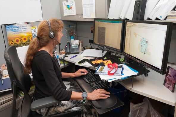 Fernando Rodriguez, left, BRAC program management division post transfer manager with the Air Force Civil Engineer Center's Base Realignment and Closure program, and Matthew Fischer access GeoBase at Joint Base San Antonio-Lackland, Texas, June 20, 2019. A BRAC team developed and transferred geospatial data for 39 BRAC installations onto the Air Force GeoBase, which centralizes all geospatial data and utilizes modern information procedures and technology to display and query data quickly and accurately. (U.S. Air Force photo by Malcolm McClendon)