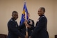 Col. Terrence Adams, 628th Air Base Wing commander, passes the 628th Comptroller Squadron guidon to Maj. Jahayra N. Lowe, 628th CPTS commander June 27, 2019 at Joint Base Charleston, S.C. The squadron bid farewell to Lt. Col. Bryan Collins, the outgoing commander, and welcomed Lowe as the new squadron commander. The passing of the guidon is a ceremonious representation of an incoming commander's assumption of command. The change of command ceremony acts as a formal transfer of responsibility, authority and accountability from the outgoing to incoming commander.