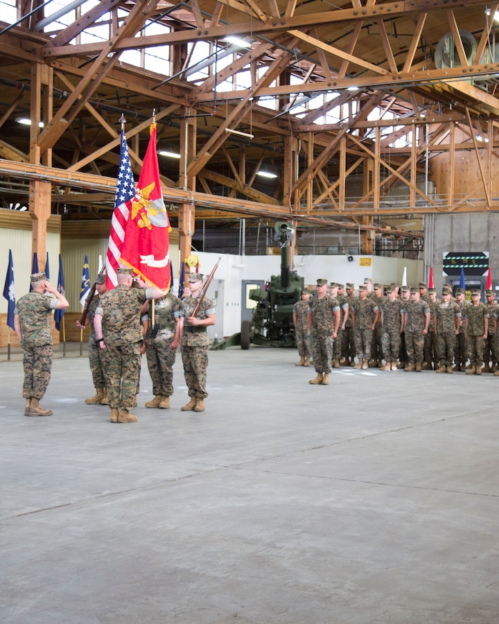 Lieutenant Colonel Micheal Graham, commanding officer, and Gunnery Sgt. Osvaldo Zaragoza, senior enlisted advisor, salute after uncasing the unit colors during the activation ceremony for the 1st Force Storage Battalion on the Yermo Annex aboard Marine Corps Logistics Base Barstow, Calif., June 26.