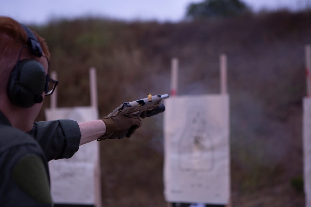 Sgt. Patrick Cronk, a Marine Corps Air Station Miramar Special Reactions Team (SRT) member, fires the M45A1 Service Pistol during training at MCAS Miramar, Calif., June 26. The Marines conducted this training to improve their ability to perform in close quarter combat. (U.S. Marine Corps photo by Lance Cpl. Raynaldo Ramos)