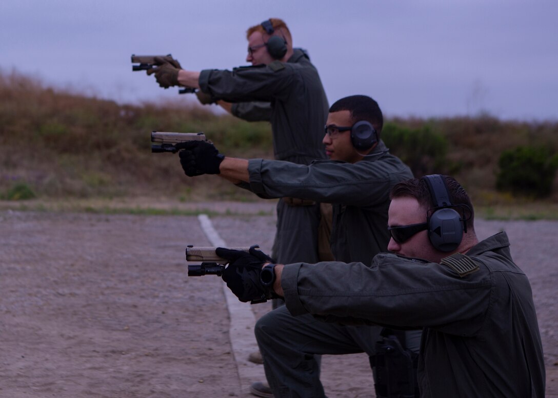 Marines from Marine Corps Air Station Miramar Special Reactions Team (SRT), fire the M45A1 Service Pistol during training at MCAS Miramar, Calif., June 26. The Marines conducted this training to improve their ability to perform close quarter combat. (U.S. Marine Corps photo by Lance Cpl. Raynaldo Ramos)