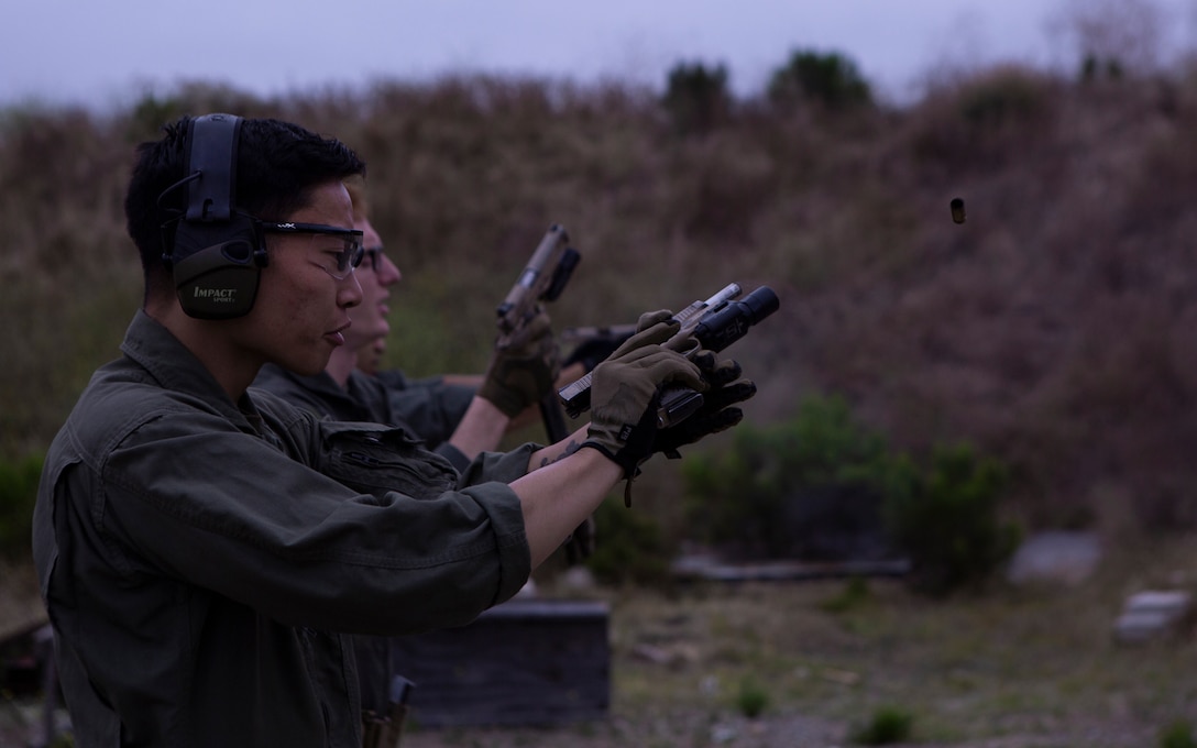 Cpl. Jeremy Chow, a Marine Corps Air Station Miramar Special Reactions Team (SRT) member, conducts a speed reload with the M45A1 Service Pistol during training at MCAS Miramar, Calif., June 26. The Marines conducted this training to improve their ability to perform in close quarter combat. (U.S. Marine Corps photo by Lance Cpl. Raynaldo Ramos)