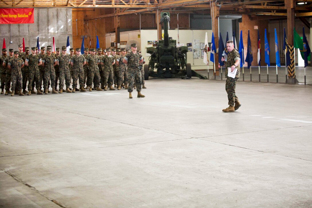The Marines of 1st Force Storage Battalion are first addressed by their new commanding officer. Lt. Col. Michael R. Graham, during the 1st FSB activation ceremony June 26.
