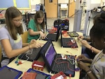 Grace Kistler, left, and Grace Madsen learn the basics of electrical circuits using conductive and insulating play dough during the Randolph Field Independent School District STEAM Camp June 17-20 at Randolph Elementary School. Forty-five elementary- and middle-school students participated in the camp, which was financed by a grant from the Department of Defense Education Activity.