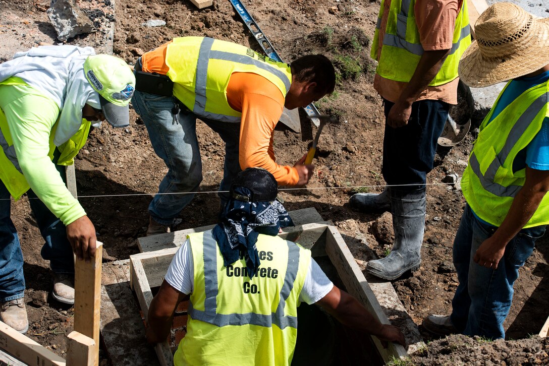 Construction workers build frames for a catch basin during a storm-drain construction project, June 25, 2019, at Moody Air Force Base, Ga. This construction will benefit the base by alleviating flooding, preventing deterioration and erosion and saving money. (U.S. Air Force photo by Senior Airman Erick Requadt)