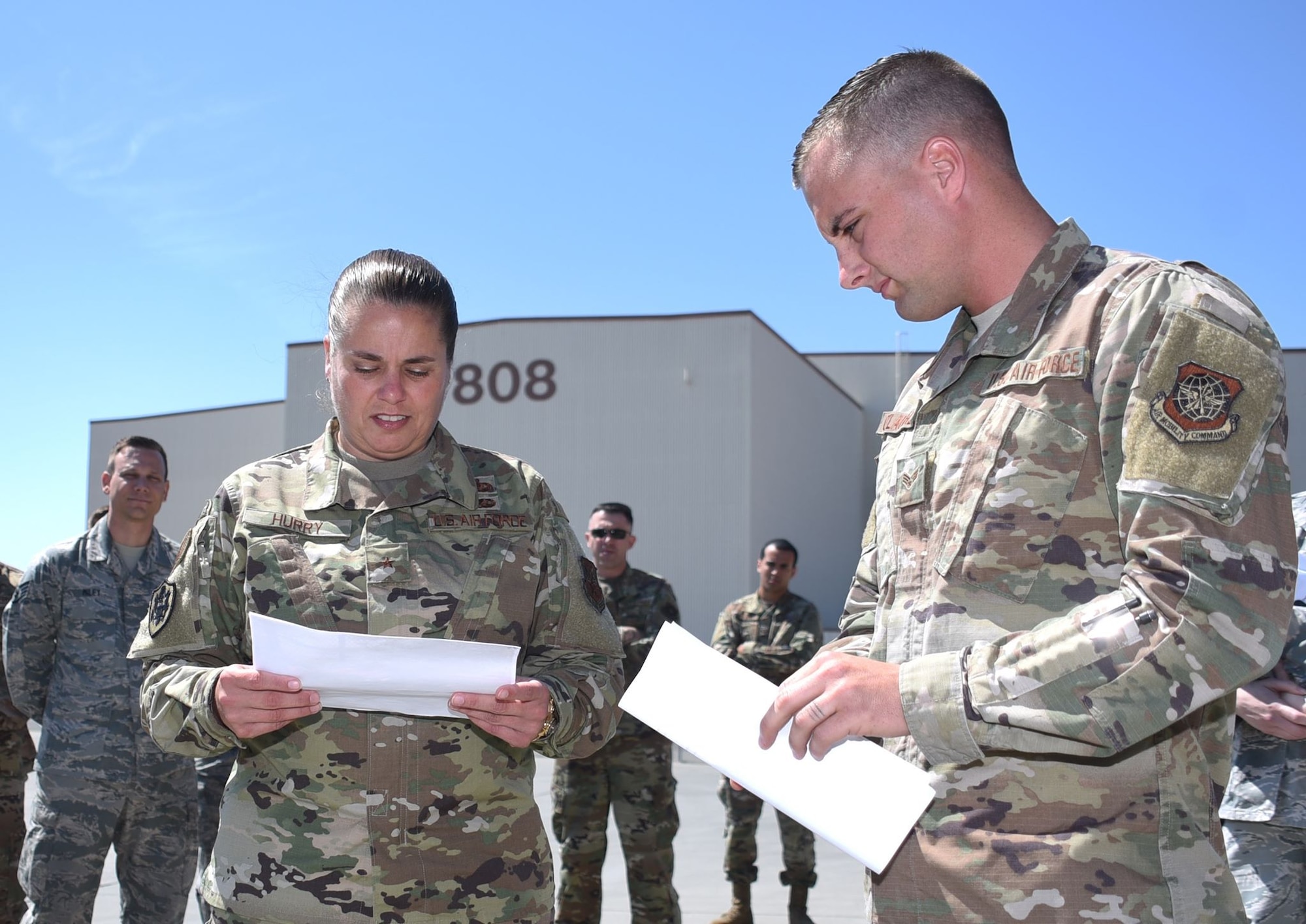 U.S. Air Force Brig. Gen. Linda Hurry, Defense Logistics Agency Aviation commander, reviews schematics of a prototype fuel truck with Senior Airman Tanner O'Laughlin, 60th Logisitcs Readiness Squadron fuels distribution operator, as part of her visit June 17, 2019, to Travis Air Force Base, California. O'Laughlin received special recognition from the general for his idea of restructuring Travis' fuel trucks, making the process of refueling aircraft more efficient. (U.S. Air Force photo by Senior Airman Christian Conrad)