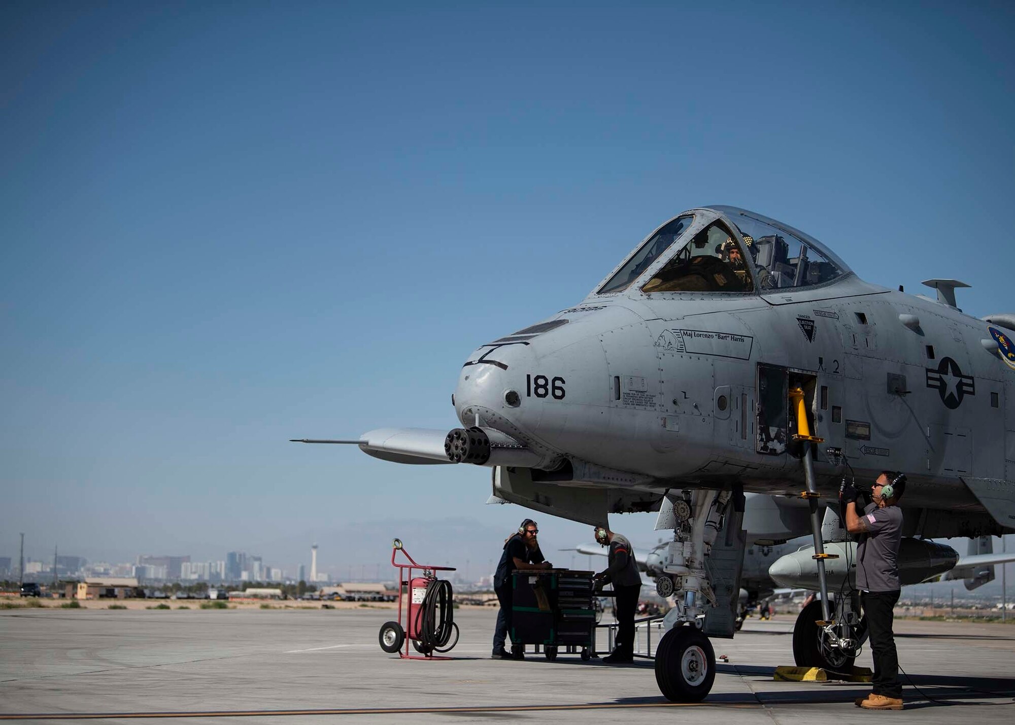 An A-10 Thunderbolt II assigned to the 86th Weapons Squadron prepares to launch with the help of its Maintenance First Support Service team at Nellis Air Force Base, Nev., June 21, 2019. Pilots assigned to the 6th Combat Training Squadron and 66th Weapons Squadron performed a flyover at 2nd Lt. James Lord’s funeral who was a World War II P-47 Thunderbolt pilot who returned home after remaining in POW/MIA status for more than 70 years. (U.S. Air Force photo by Airman 1st Class Bryan Guthrie)