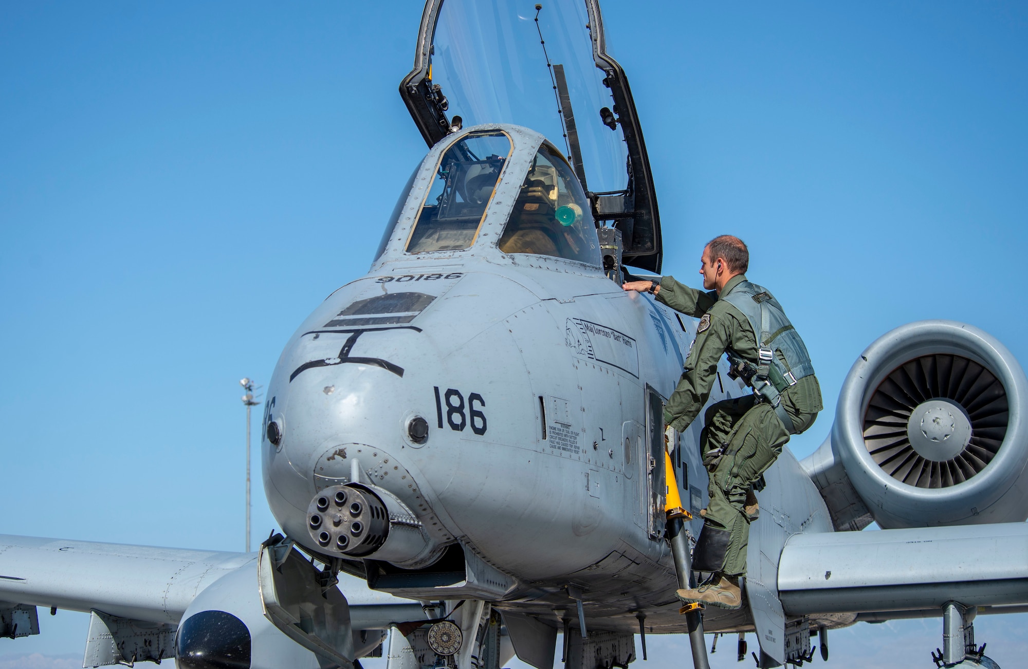 U.S. Air Force Lt. Col. James Kappes, 6th Combat Training Squadron (CTS) director of operations, climbs into his A-10 Thunderbolt II at Nellis Air Force Base, Nev., June 21, 2019. Members from the 6th CTS and 66th Weapons School assembled for a memorial flyover for 2nd Lt. James Lord, who was a P-47 Thunderbolt pilot in 1944. (U.S. Air Force photo by Staff Sgt. Tabatha McCarthy)