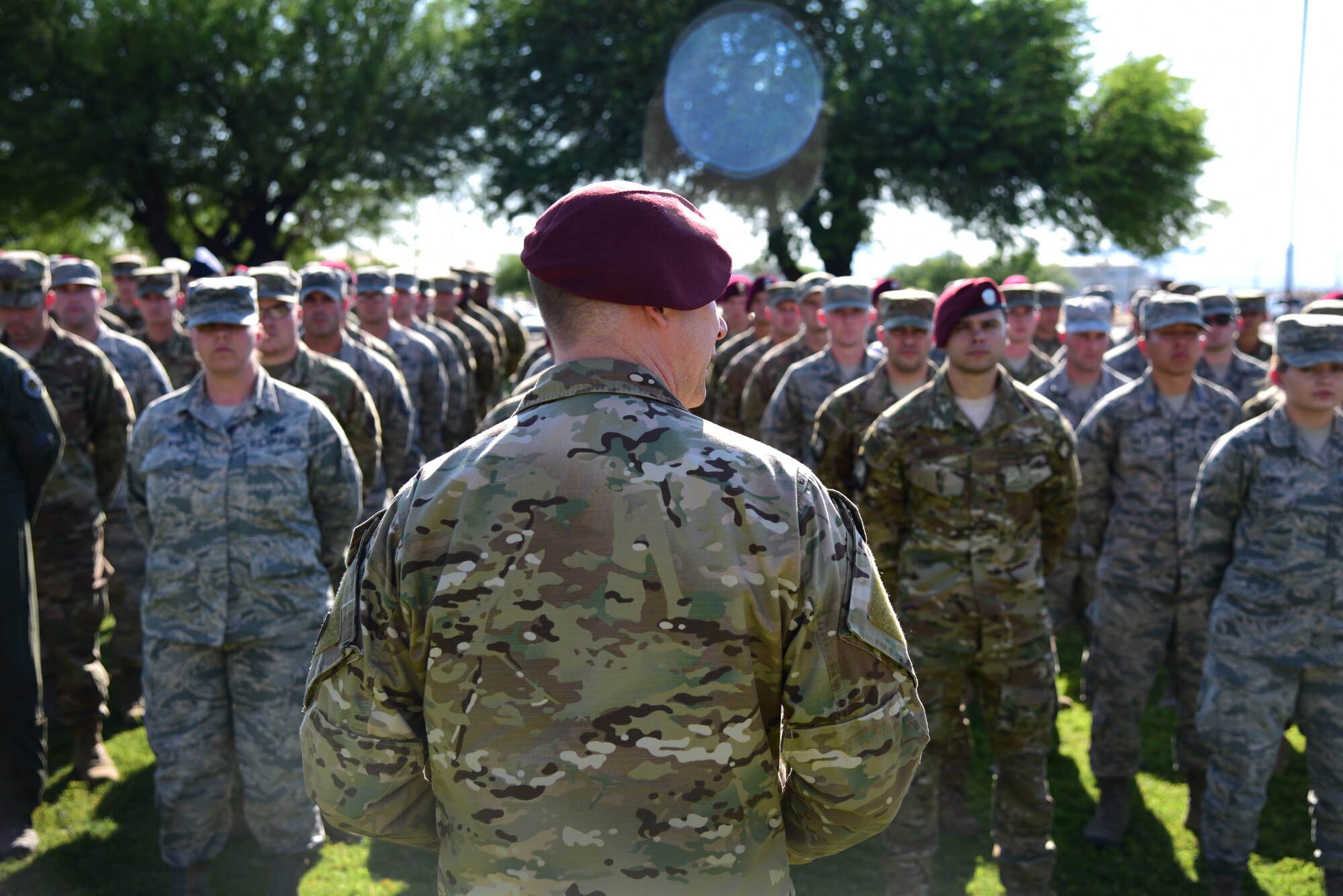 Chief Master Sgt. Konrad Schwinn, 563d Rescue Group Superintendent, speaks at the Wing Retreat Ceremony outside of Leo K. Thorsness Hall on Davis-Monthan Air Force Base, Ariz., June 27, 2019. Schwinn spoke about the sacrifices that Senior Airman Bejamin White and Tech. Sgt. Michael Flores made when they were killed in action June 9, 2010