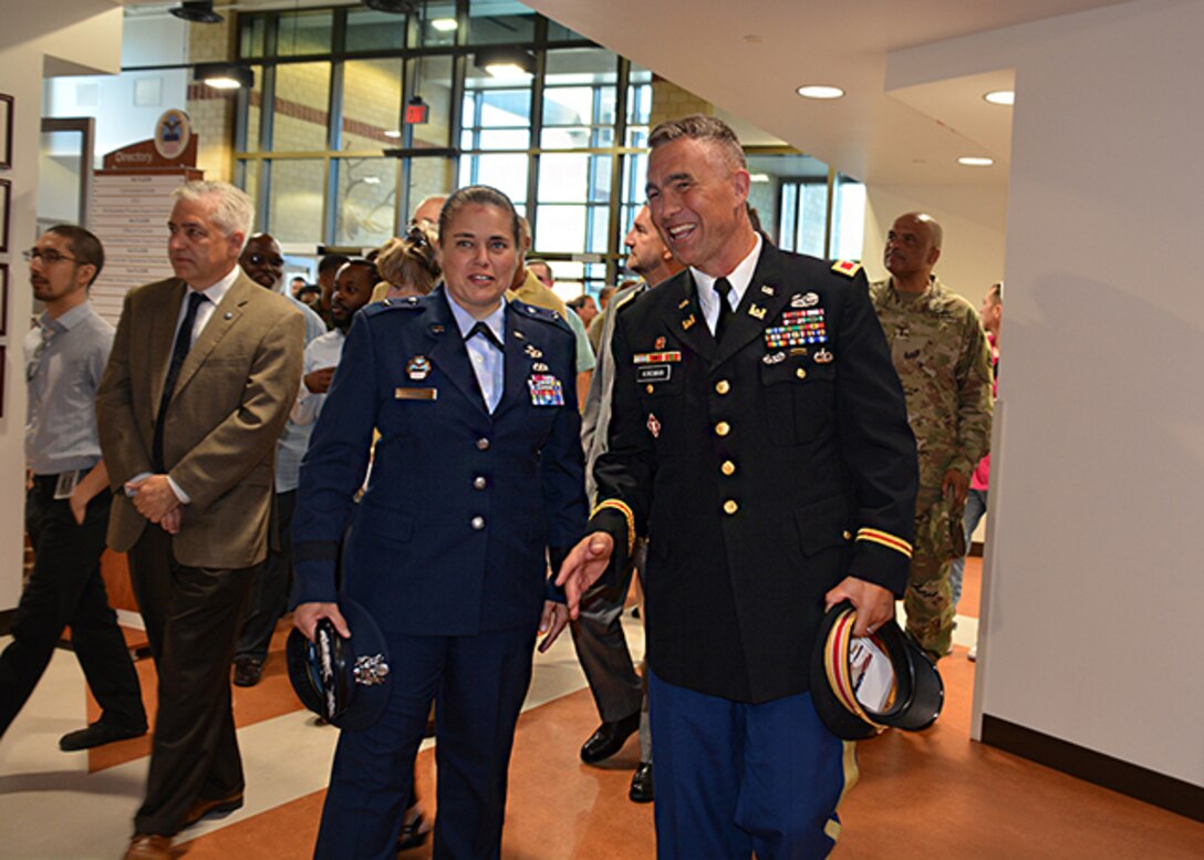 Brig Gen Hurry and Col Kinsman walk into DLA Aviation Operations Center
