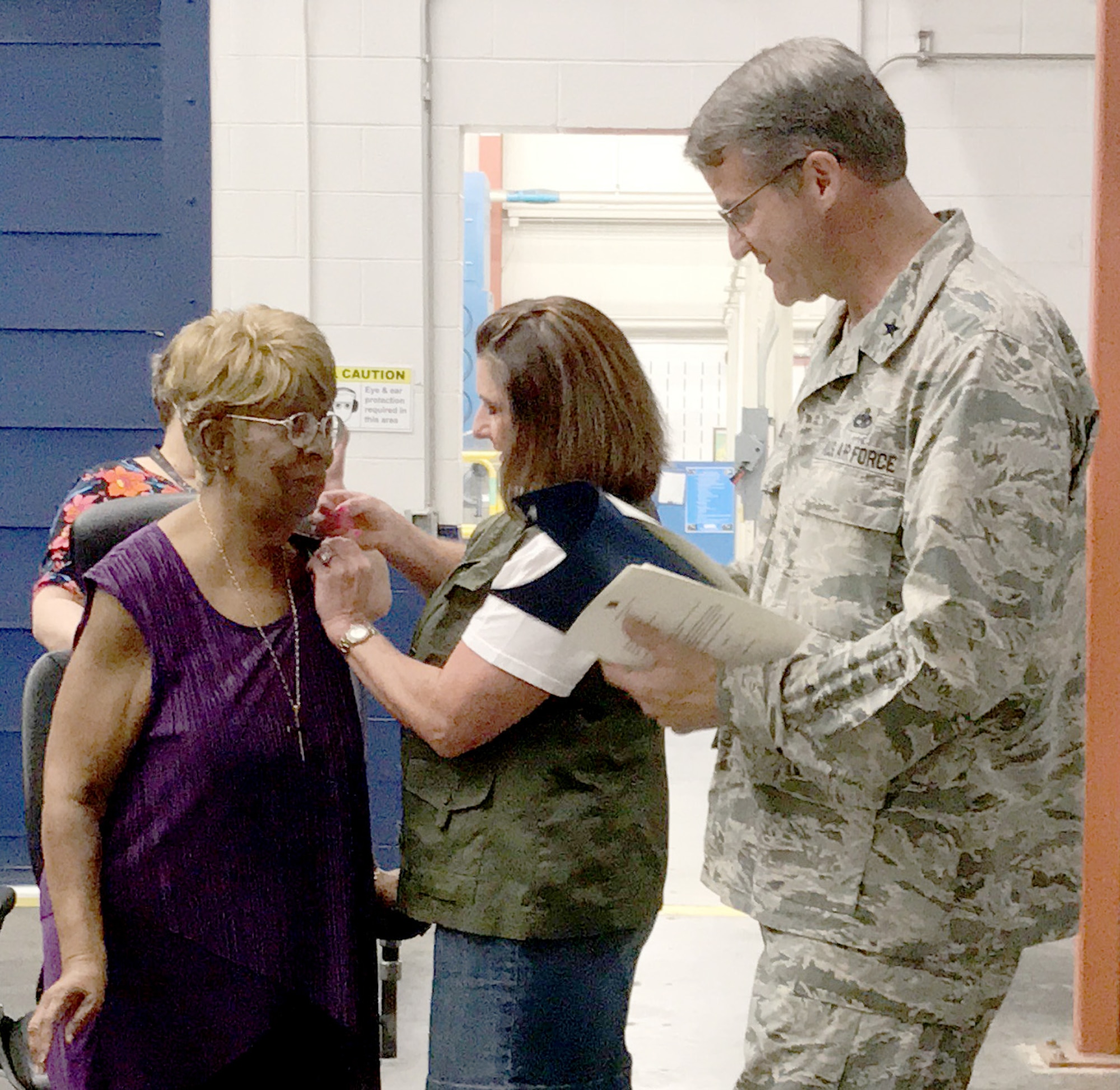 Donnetta Martin, 547th Propulsion Maintenance Group, received a 50-year service pin from Jetta Reed with the Oklahoma City Air Logistics Complex and OC-ALC Commander Brig. Gen. Chris Hill. (Courtesy photo/Susan Johnson)