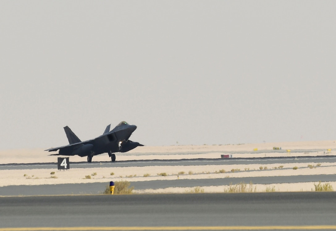 A photo of an F-22 landing.