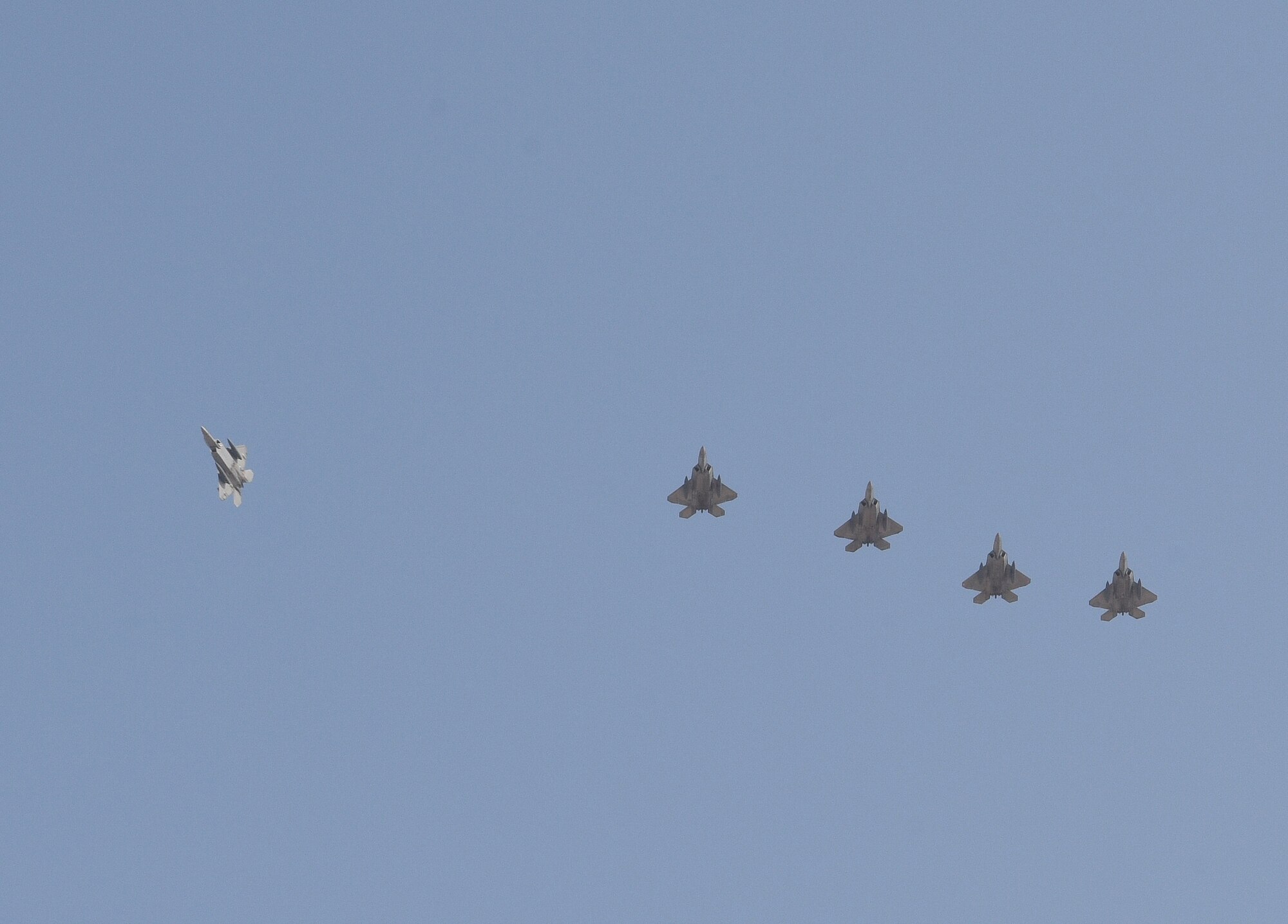 A photo of F-22s in formation.