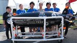 University of California San Diego team (from left) Kristina Koharchik, Signe Laundrup, Tyler Jang, Chelwei Jang, Andrew Cai, Raymond Seraydarian and Junsong Kim stand with their submarine, the Santiana, at the 15th International Submarine Races at Naval Surface Warfare Center, Carderock Division in West Bethesda, Md., on June 26