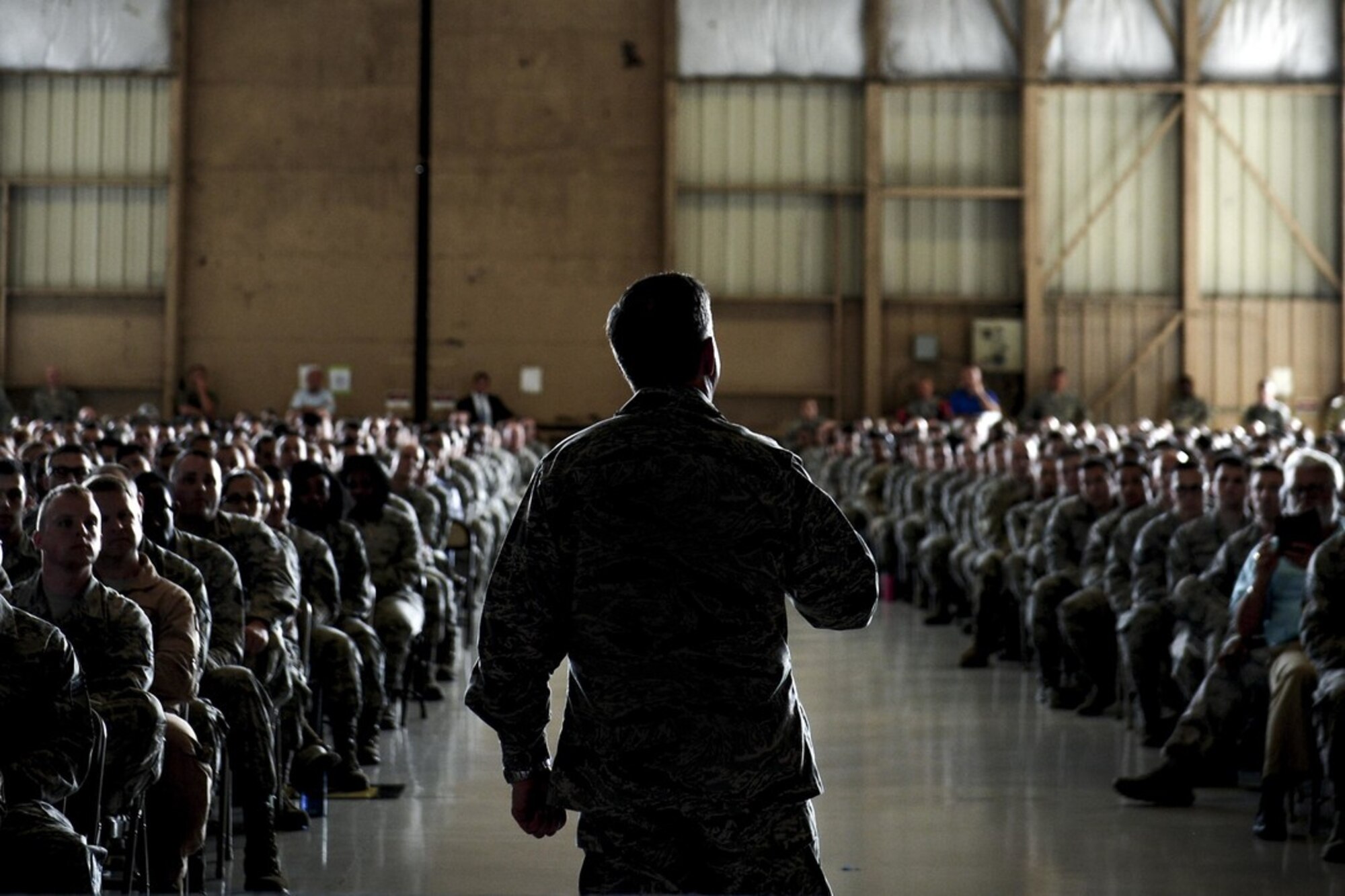 Airmen listen as Air Force Chief of Staff Gen. David L. Goldfein speaks about current Air Force operations during an all-call at Shaw Air Force Base, May 30, 2017. During the all-call Airmen asked Goldfein questions about the current state of the Air Force and the direction the service is headed. (U.S. Air Force photo/Airman 1st Class Christopher Maldonado)